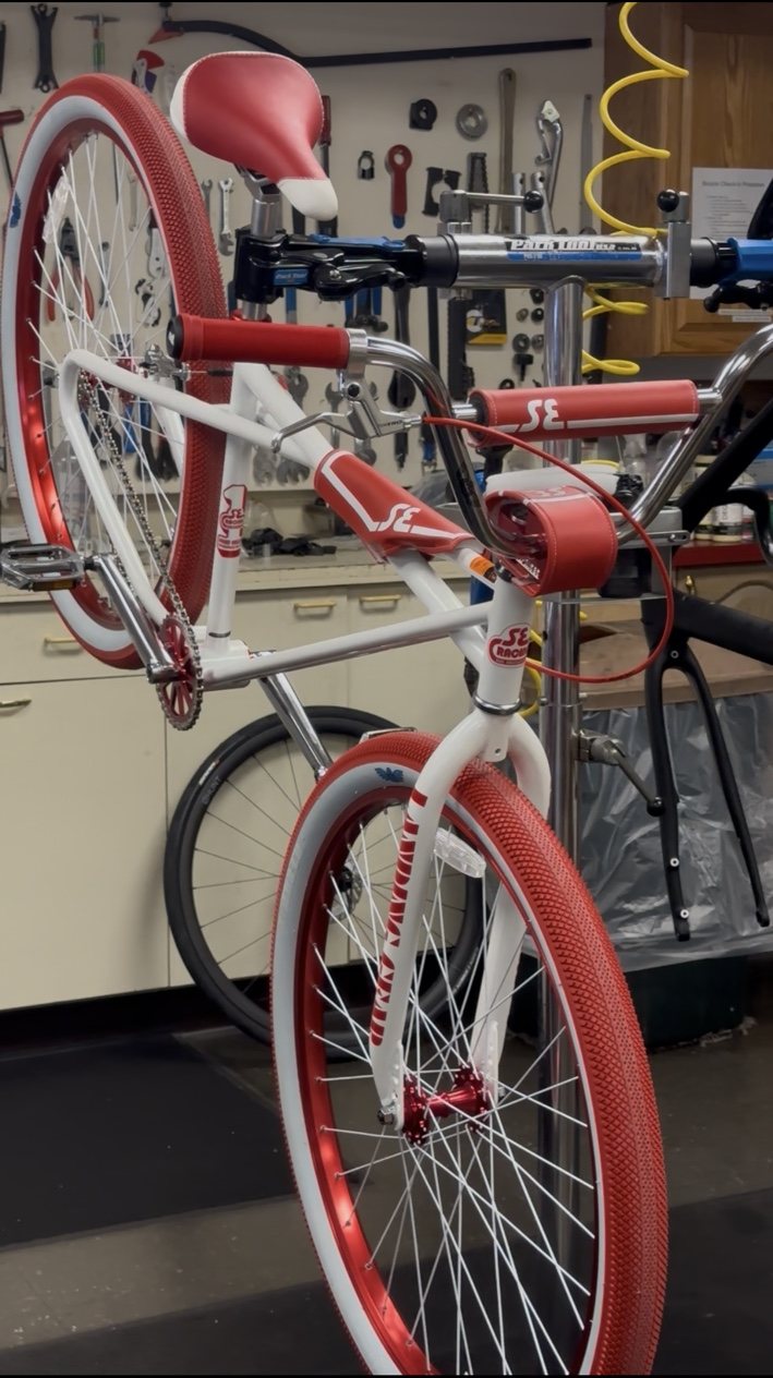 Bike repair stand inside Bicycles Plus in Franklin MA